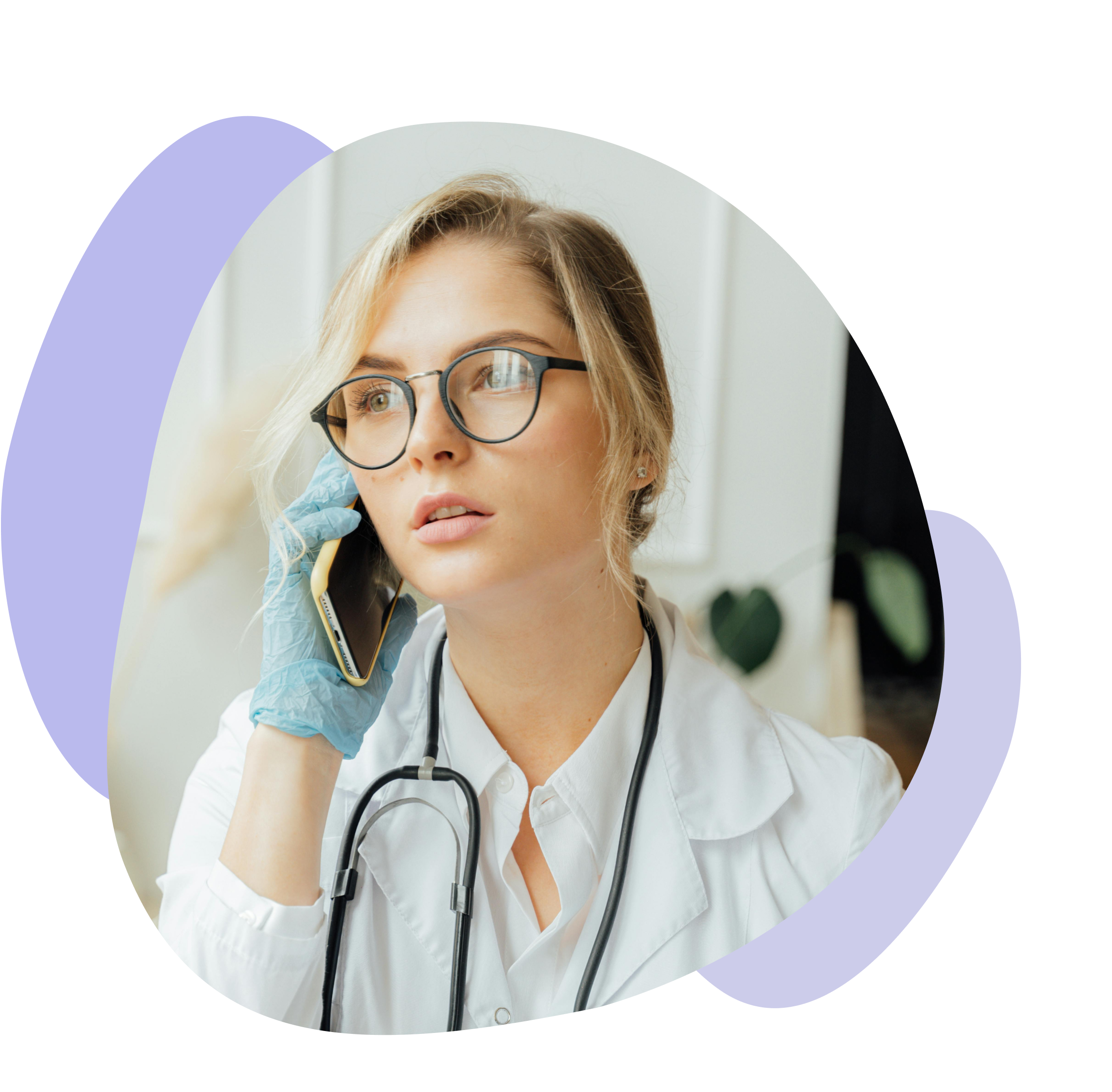 Female doctor in a white coat and gloves speaks on the phone, symbolizing dermatology teleconsultation