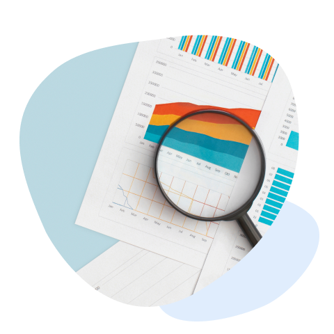 Magnifying glass zooms in on colorful reports and charts, emphasizing data analytics.