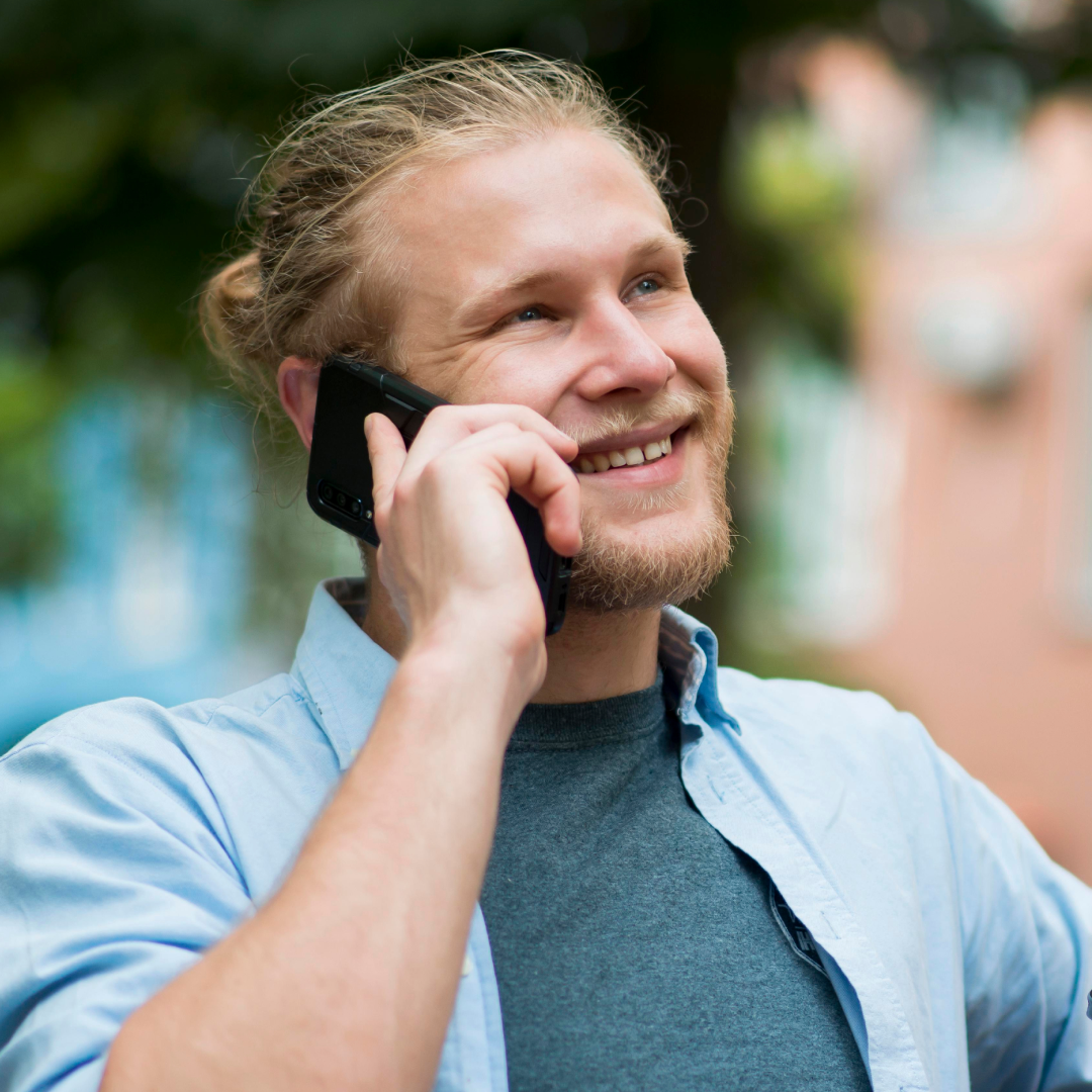 Man talking through a phone with AI Agent