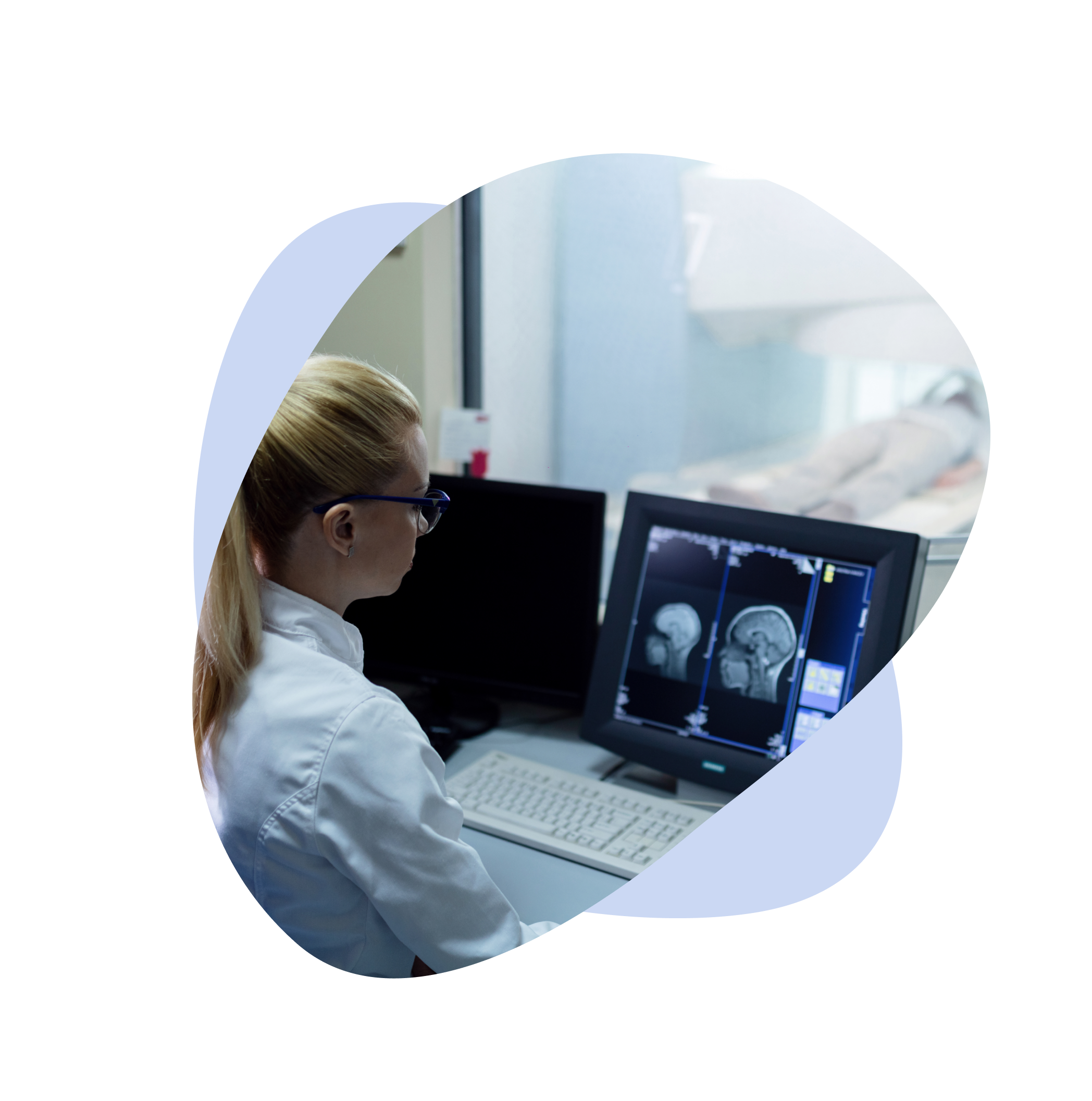 Medical specialist reviewing brain scan images on a computer in a diagnostic lab